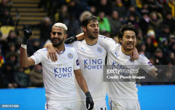 Riyad Mahrez of Leicester City celebrates with Shinji Okazaki and Aleksandar Dragovic of Leicester City after scoring to make it 0-1 during the...