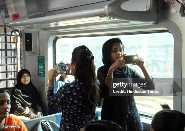 Commuters travel in first Air Condition local train from Borivali to Churchgate on December 25, 2017 in Mumbai, India. The train, operated by the...