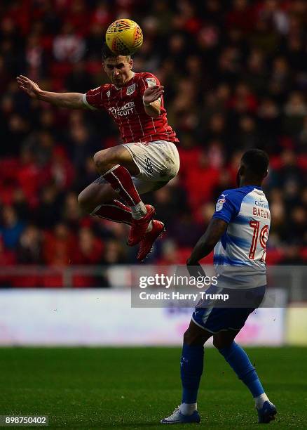 Joe Bryan of Bristol City wins the aerial ball ahead of Leandro Bacuna of Reading during the Sky Bet Championship match between Bristol City and...