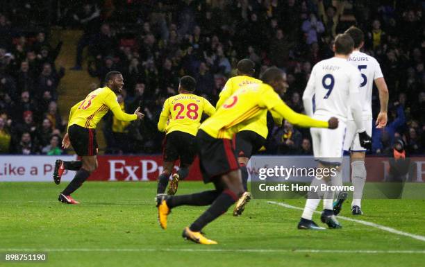 Molla Wague of Watford celebrates scoring his team's opening goal during the Premier League match between Watford and Leicester City at Vicarage Road...