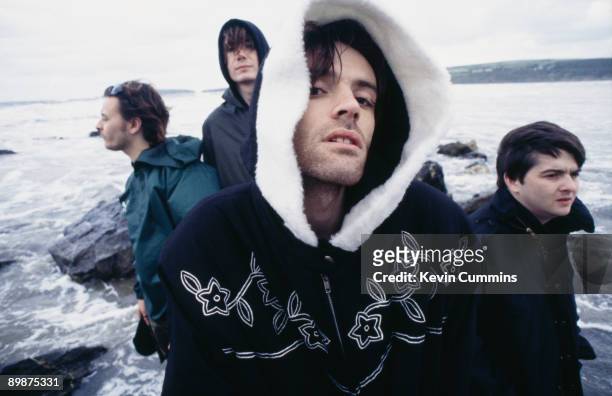 Welsh alternative rock group the Manic Street Preachers, on the beach at Swansea, south Wales, 19th August 1994. Left to right: singer James Dean...