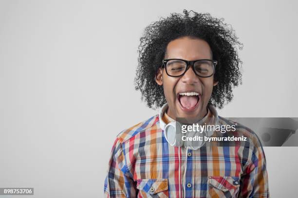 young guy screaming - word of mouth stock pictures, royalty-free photos & images
