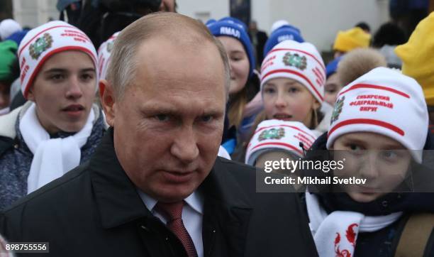 Russian President Vladimir Putin chats with kids at the on December 26, 2017 in the Cathedral Square of Moscow's Kremlin, Russia. Vladimir Putin met...