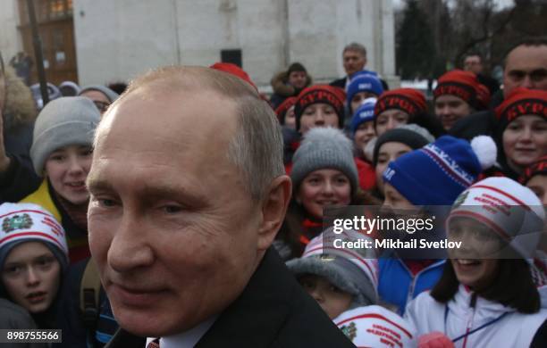 Russian President Vladimir Putin pose for a photo with kids at the on December 26, 2017 in the Cathedral Square of Moscow's Kremlin, Russia. Vladimir...