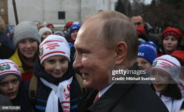 Russian President Vladimir Putin chats with kids at the on December 26, 2017 in the Cathedral Square of Moscow's Kremlin, Russia. Vladimir Putin met...