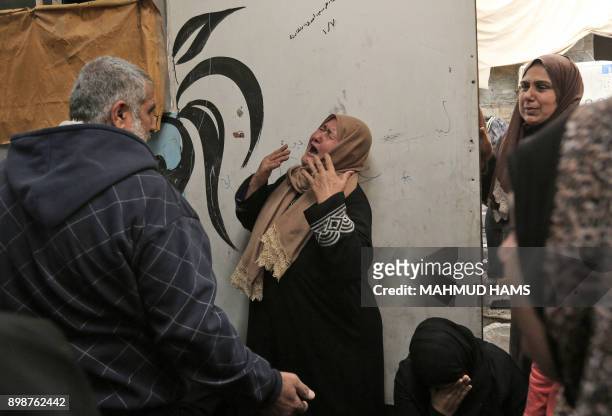 Relatives of Zakaria al-Kafarneh, who was killed during clashes with Israeli troops, mourn during his funeral in Beit Hanoun in the northern Gaza...