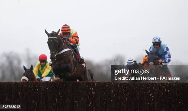 Might Bite ridden by Nico de Boinville clear an early fence before going on to win The 32Red King George VI Steeple Chase Race run during the 32Red...