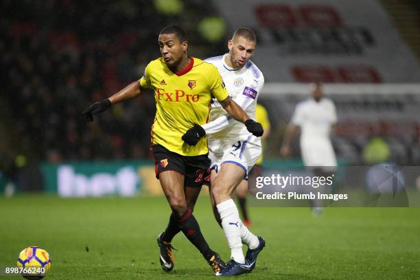 Islam Slimani of Leicester City in action with Marvin Zeegelaar of Watford during the Premier League match between Watford and Leicester City at...