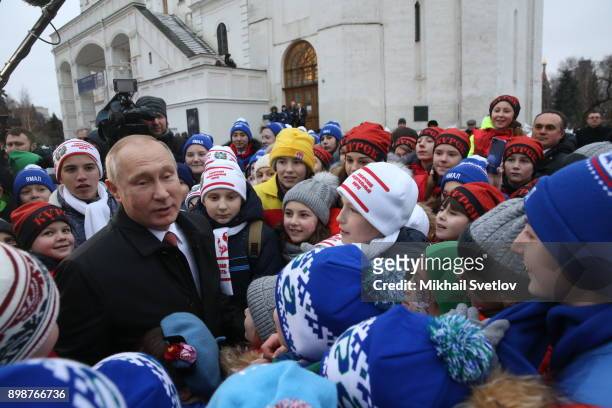 Russian President Vladimir Putin chats with kids at the Cathedral Square of Moscow's Kremlin, Russia, December 2017. Vladimir Putin met children from...