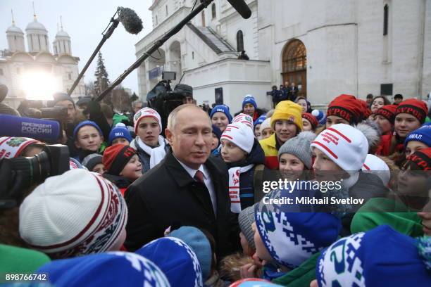 Russian President Vladimir Putin chats with kids at the Cathedral Square of Moscow's Kremlin, Russia, December 2017. Vladimir Putin met children from...