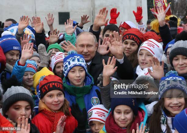 Russian President Vladimir Putin pose for a photo with kids at the Cathedral Square of Moscow's Kremlin, Russia, December 2017. Vladimir Putin met...