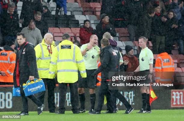 Match referee Bobby Madley speaks to West Ham United manager David Moyes after the final whistle during the Premier League match at the Vitality...