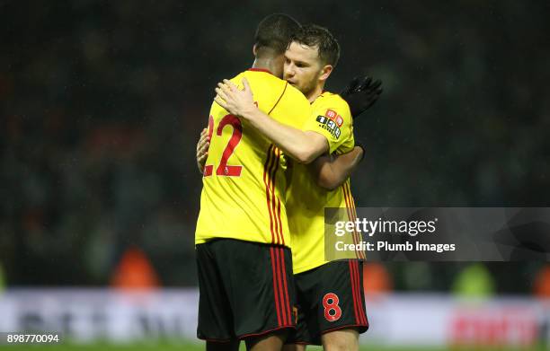 Tom Cleverley of Watford celebrates with Marvin Zeegelaar of Watford after the Premier League match between Watford and Leicester City at Vicarage...