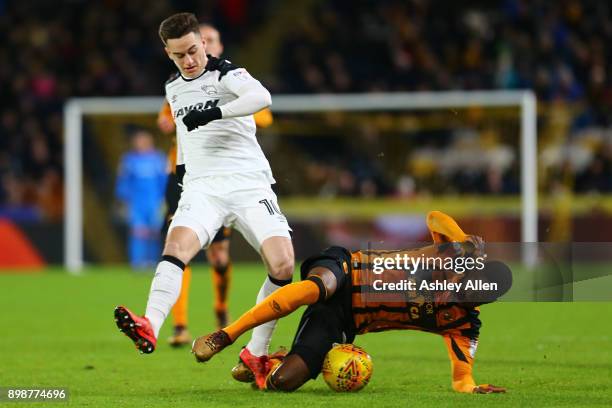 Tom Lawrence of Derby County is tackled by Fikayo Tomori of Hull City during the Sky Bet Championship match between Hull City and Derby County at...