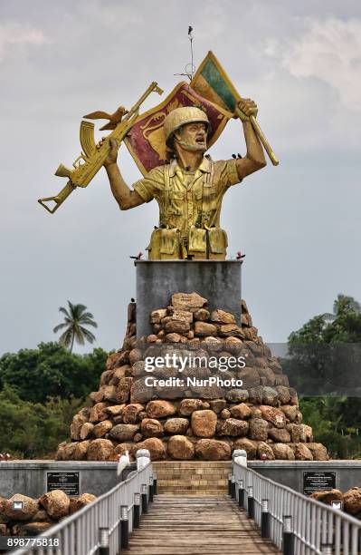 Victory Monument in Puthukkudiyiruppu, Northern Province, Sri Lanka. This monument depicts a Sri Lankan Army solider waving a flag in one hand and...