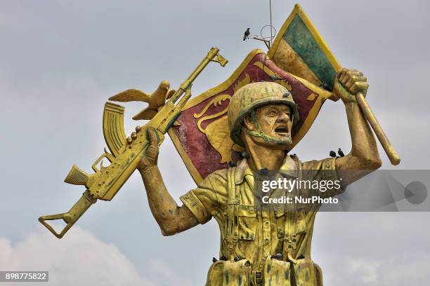 Victory Monument in Puthukkudiyiruppu, Northern Province, Sri Lanka. This monument depicts a Sri Lankan Army solider waving a flag in one hand and...