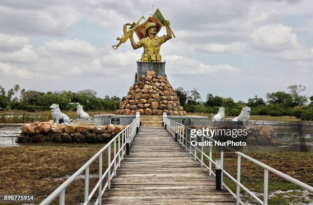 Victory Monument in Puthukkudiyiruppu, Northern Province, Sri Lanka. This monument depicts a Sri Lankan Army solider waving a flag in one hand and...