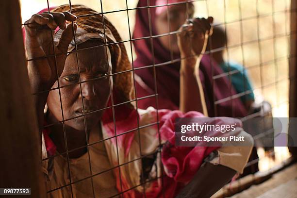 Women wait to receive medicine inside of a Doctors Without Borders medical station in Dadaab, the world�s biggest refugee camp August 19, 2009 in...