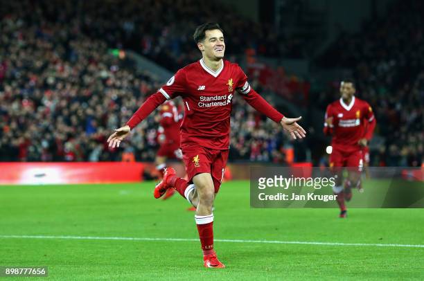 Philippe Coutinho of Liverpool scores his sides first goal during the Premier League match between Liverpool and Swansea City at Anfield on December...