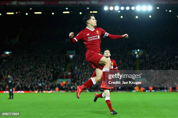 Philippe Coutinho of Liverpool scores his sides first goal during the Premier League match between Liverpool and Swansea City at Anfield on December...