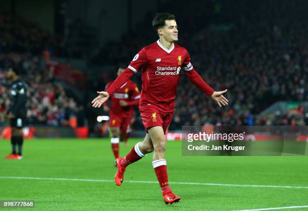 Philippe Coutinho of Liverpool scores his sides first goal during the Premier League match between Liverpool and Swansea City at Anfield on December...