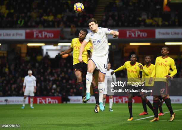Harry Maguire of Leicester City jumps for a header with Marvin Zeegelaar of Watford during the Premier League match between Watford and Leicester...