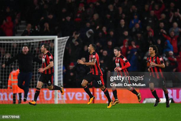 Callum Wilson of AFC Bournemouth celebrates with his team mates after scoring his sides third goal during the Premier League match between AFC...