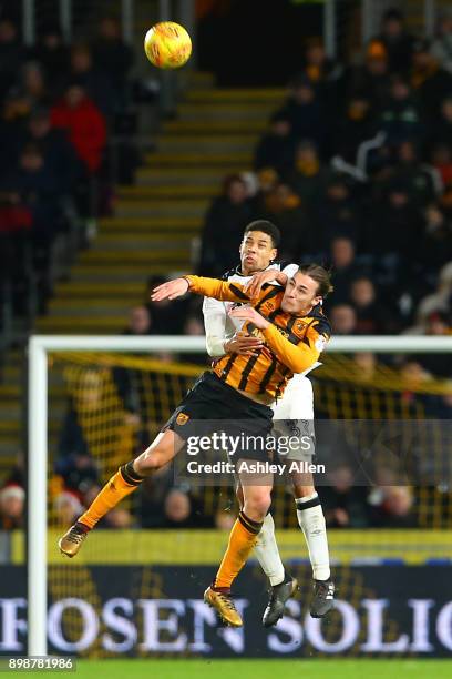 Curtis Davis of Derby County is challenged in the air by Jackson Irvine of Hull City during the Sky Bet Championship match between Hull City and...