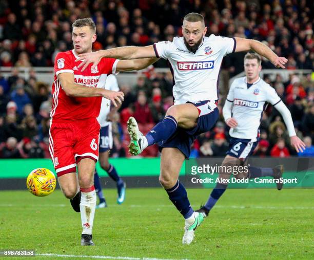 Bolton Wanderers' Aaron Wilbraham can't quite connect with a cross under pressure from Middlesbrough's Ben Gibson during the Sky Bet Championship...