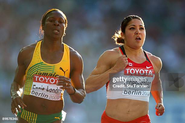 Delloreen Ennis-London of Jamaica and Priscilla Lopes-Schliep of Canada compete in the women's 200 Metres Heats during day five of the 12th IAAF...