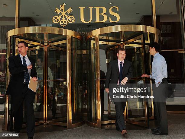 People enter and leave the building of Swiss Bank UBS in Midtown Manhattan August 19, 2009 in New York City. UBS will release over 4,000 names of...