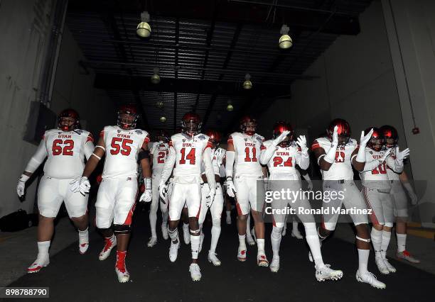 The Utah Utes walk to the field before Zaxby's Heart of Dallas Bowl against the West Virginia Mountaineers on December 26, 2017 at Cotton Bowl in...