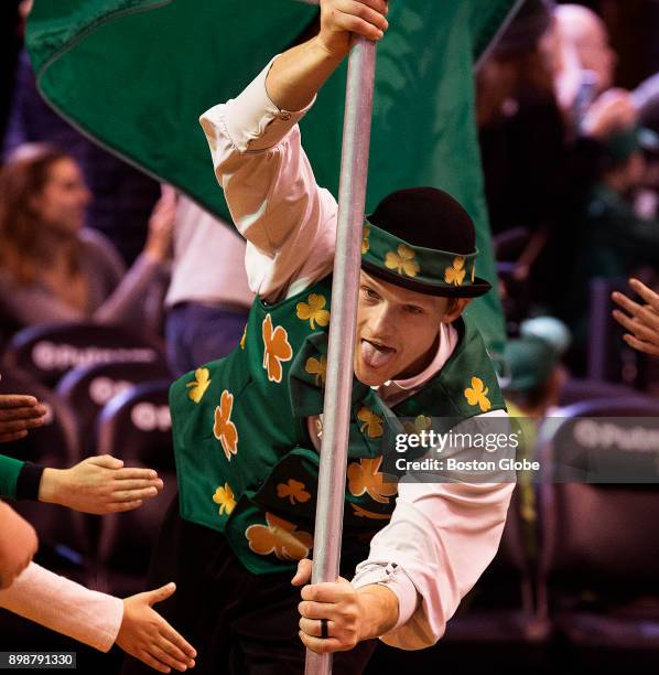 Boston Celtics team mascot Lucky the Leprechaun leads the team onto the court at TD Garden in Boston on Dec. 6, 2017. As they strive for an 18th NBA...