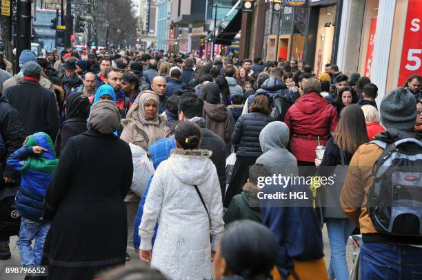 Shoppers on Oxford Street hit the Boxing Day Sales on December 26, 2017 in London, England. According to reports, a decrease for in-store shopping is...