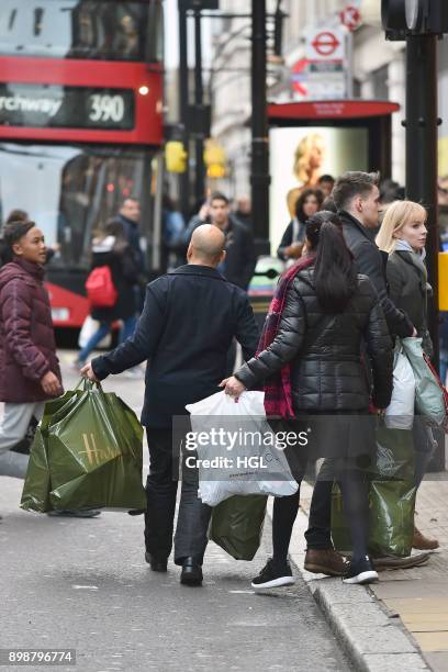 Shoppers on Oxford Street hit the Boxing Day Sales on December 26, 2017 in London, England. According to reports, a decrease for in-store shopping is...