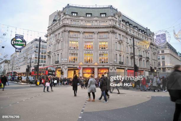 Shoppers on Oxford Street hit the Boxing Day Sales on December 26, 2017 in London, England. According to reports, a decrease for in-store shopping is...