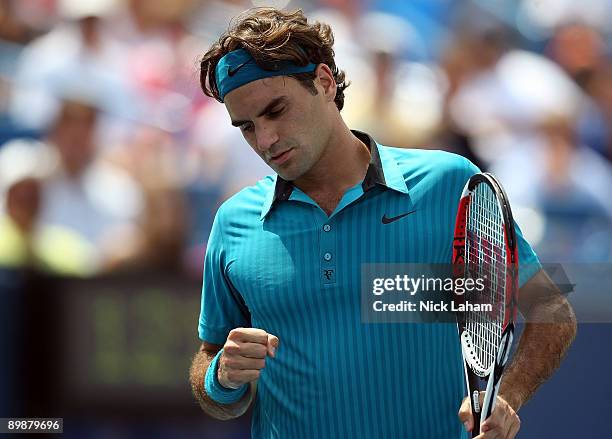 Roger Federer of Switzerland celebrates a point against Jose Acasuso of Argentina during day three of the Western & Southern Financial Group Masters...