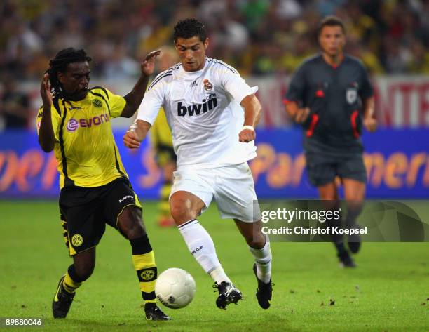 Tinga of Dortmund tackles Cristiano Ronaldo of Real Madrid during a friendly match between Borussia Dortmund and Real Madrid at the Signal Iduna Park...