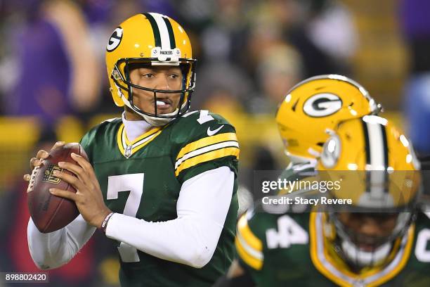 Brett Hundley of the Green Bay Packers drops back to pass during a game against the Minnesota Vikings at Lambeau Field on December 23, 2017 in Green...