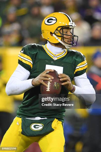 Brett Hundley of the Green Bay Packers drops back to pass during a game against the Minnesota Vikings at Lambeau Field on December 23, 2017 in Green...