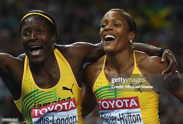 Brigitte Foster-Hylton of Jamaica celebrates winning the gold medal and Delloreen Ennis-London of Jamaica celebrates winning the bronze medal in the...