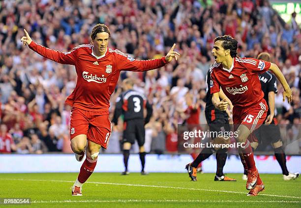 Frenando Torres of Liverpool celebrates with Yossi Benayoun after scoring the opening goal during the Barclays Premier League match between Liverpool...