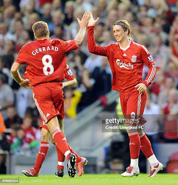 Fernando Torres celebrates with Steven Gerrard after scoring the opening goal during the Barclays Premier League match between Liverpool and Stoke...