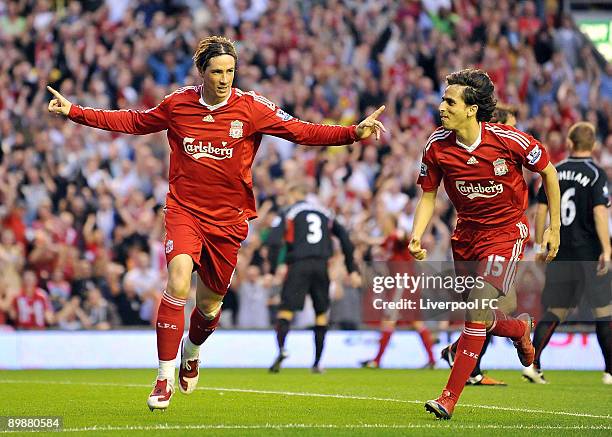 Fernando Torres celebrates after scoring the opening goal during the Barclays Premier League match between Liverpool and Stoke City at at Anfield on...