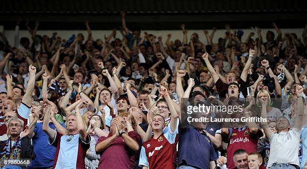 Burnley fans celebrate the goal during the Barclays Premier League match between Burnley and Manchester United at Turf Moor on August 19, 2009 in...