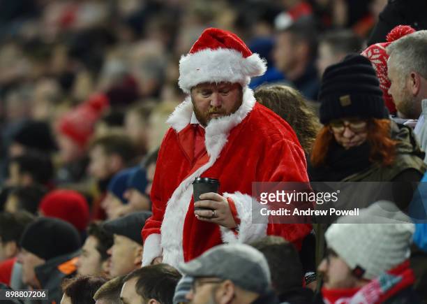 Fan of Liverpool dressed as Father Christmas during the Premier League match between Liverpool and Swansea City at Anfield on December 26, 2017 in...