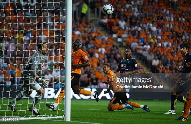 Carlo Cudicini of Tottenham Hotspur looks on as he is beaten by Stephen Hunt of Hull during the Barclays Premier League match between Hull City and...