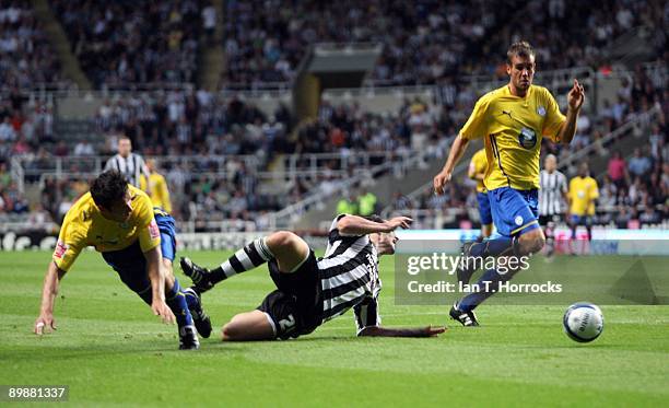 Andy Carroll is brought down in the box by Richard Wood but was denied a penalty by ref Phil Dowd during the Coca Cola Championship game between...