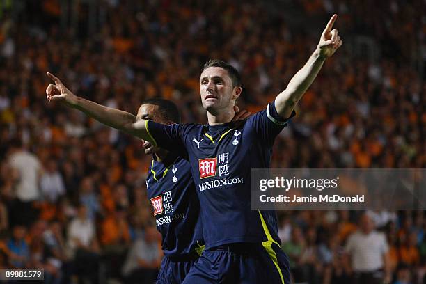 Robbie Keane of Tottenham Hotspur celebrates his goal with Aaron Lennon during the Barclays Premier League match between Hull City and Tottenham...