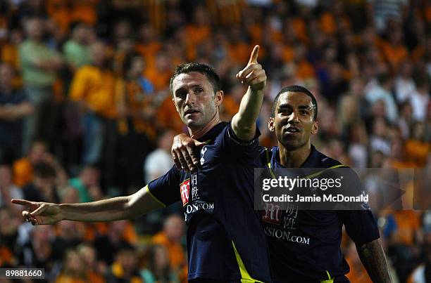 Robbie Keane of Tottenham Hotspur celebrates his goal with Aaron Lennon during the Barclays Premier League match between Hull City and Tottenham...